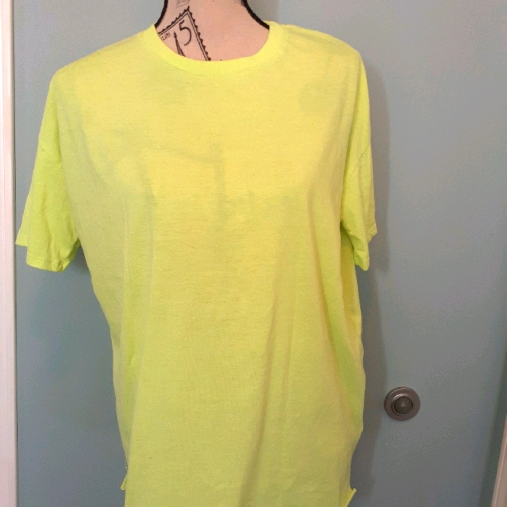 Neon green tee shirt.